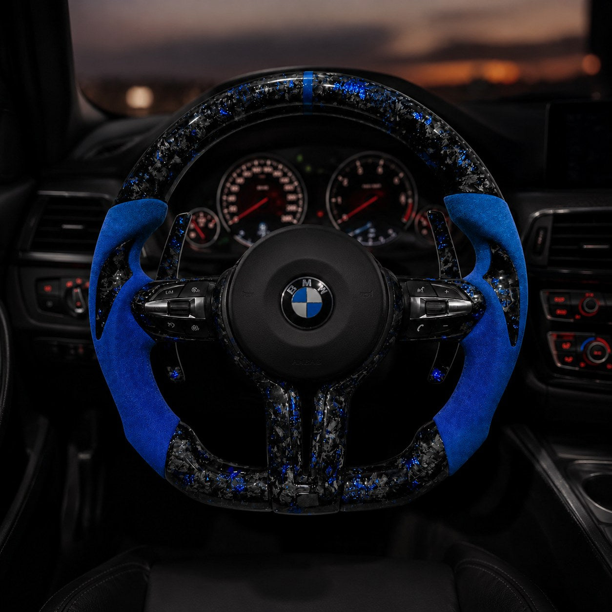 REVMODE forged carbon steering wheel installed in a BMW F-series cockpit